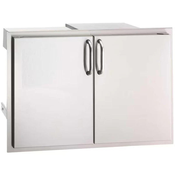Stainless steel double access doors with sleek curved handles, designed for outdoor kitchen storage and easy equipment access.