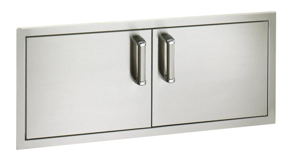 Sleek stainless steel double access doors with polished vertical handles, ideal for outdoor kitchen islands and built-in grill storage.