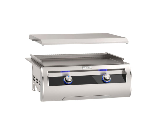 Stainless steel outdoor flat top gas griddle with removable lid and two blue LED-lit control knobs for precise backyard cooking.