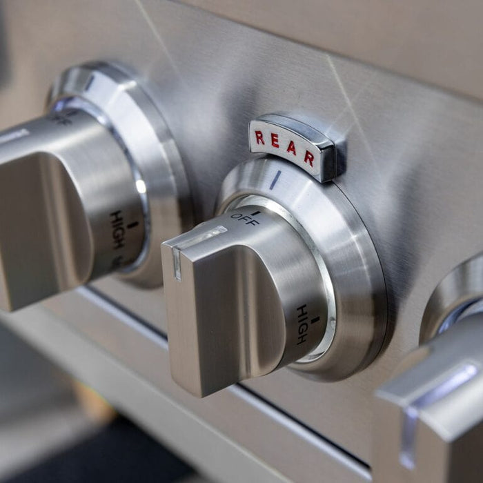 Close-up of stainless steel grill control knobs labeled high and off with rear burner indicator.