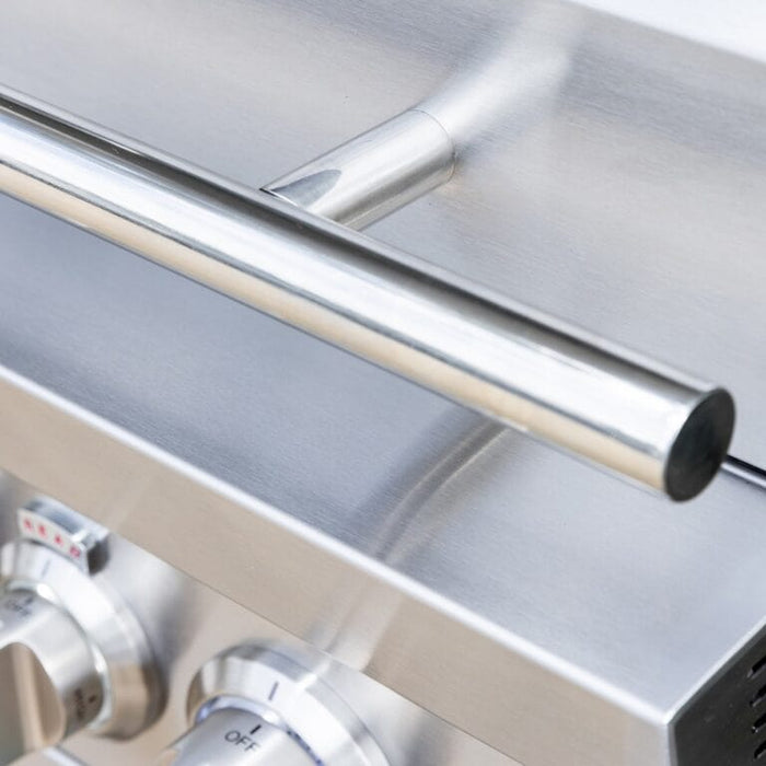 Close-up of stainless steel grill showing sturdy tubular handle and polished control knobs.