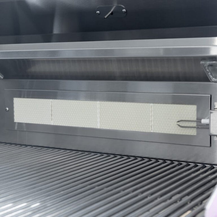 Close-up of stainless steel grill interior showing infrared back burner and heavy-duty cooking grates.