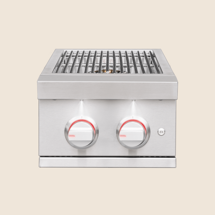 Stainless steel outdoor grill with two illuminated red control knobs and metal cooking grates for precise heat management.