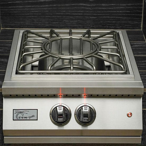 Stainless steel outdoor power burner with dual control knobs illuminated by LED lights, featuring a sturdy grate and polished finish