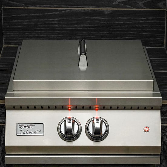 Stainless steel outdoor power burner with a closed lid, dual LED-lit control knobs, and a polished finish against a dark backsplash