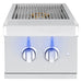 Stainless steel outdoor side burner with dual control knobs illuminated in blue, featuring a sleek grill grate and modern design.