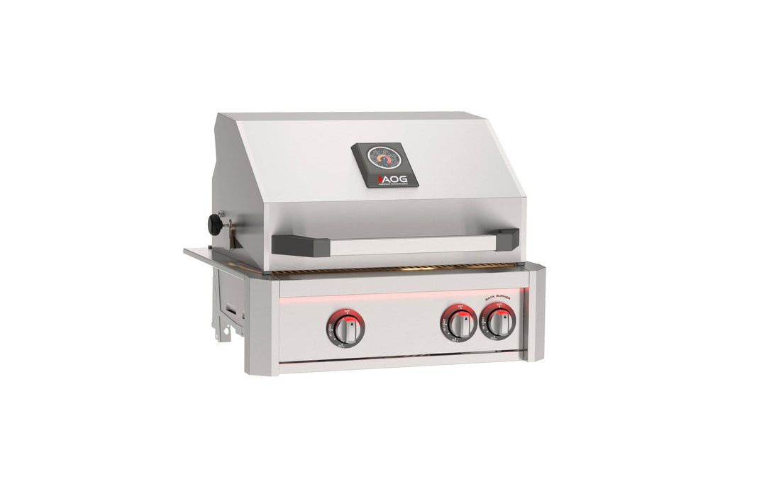 Stainless steel built-in gas grill with hood, temperature gauge, and red illuminated control knobs for outdoor kitchen installations.