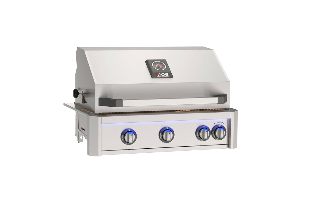 Stainless steel built-in gas grill with hood, temperature gauge, and four illuminated control knobs designed for outdoor kitchen installations.