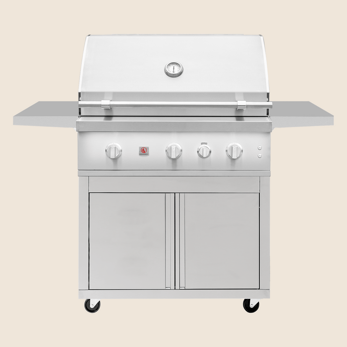 Front view of stainless steel outdoor gas grill with closed hood, side shelves, and double-door storage cabinet on caster wheels.