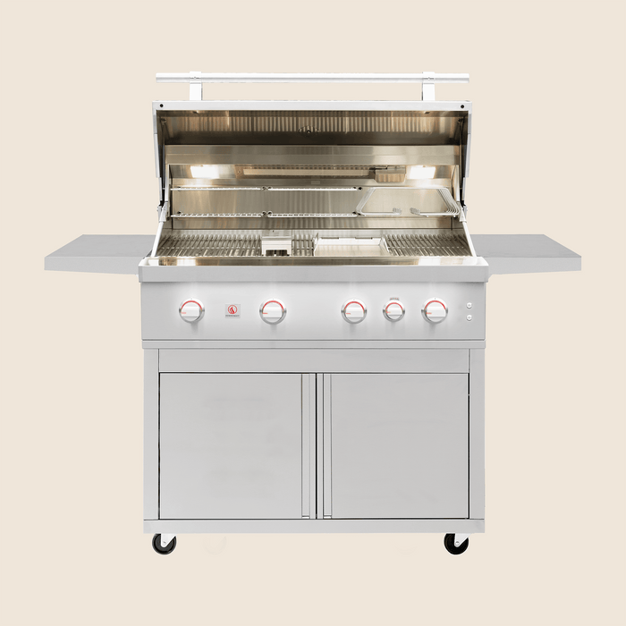Stainless steel outdoor gas grill with open hood, illuminated interior, side shelves, and four control knobs glowing red.