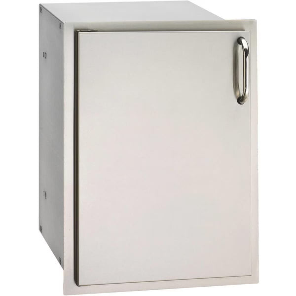 Stainless steel outdoor kitchen access door with sleek handle, designed for storage and durability in grill island setups.