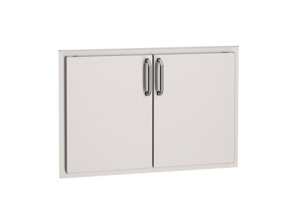 Stainless steel double access doors with sleek handles, designed for outdoor kitchen storage and easy access to grilling essentials.