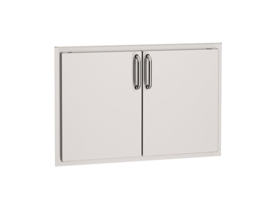 Stainless steel double access doors with sleek handles, designed for outdoor kitchen storage and easy access to grilling essentials.