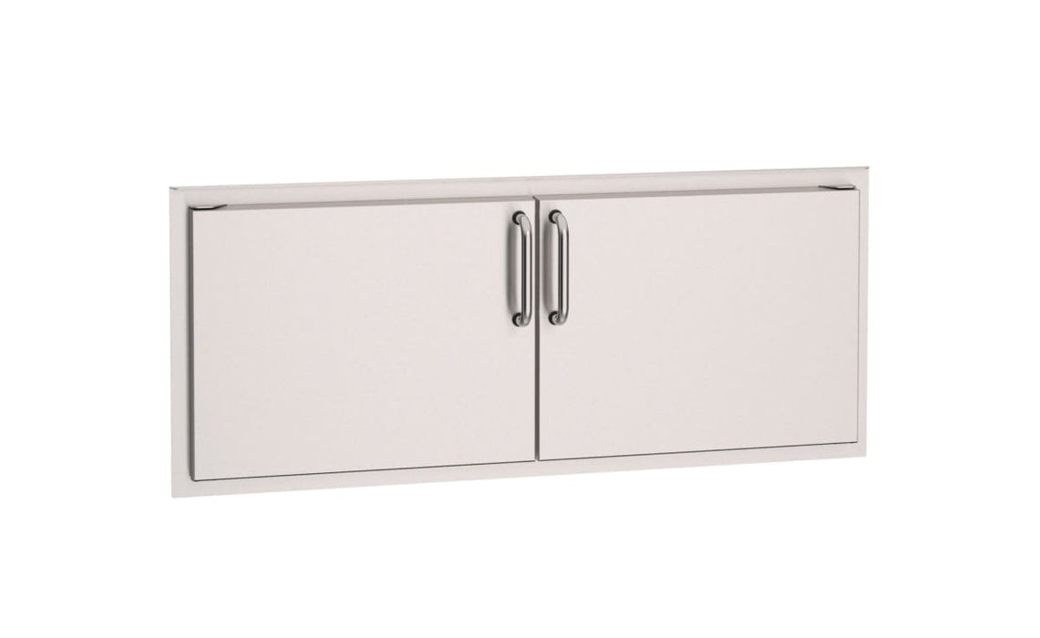 Stainless steel double access doors with sleek vertical handles, designed for outdoor kitchen storage and convenient access to supplies.