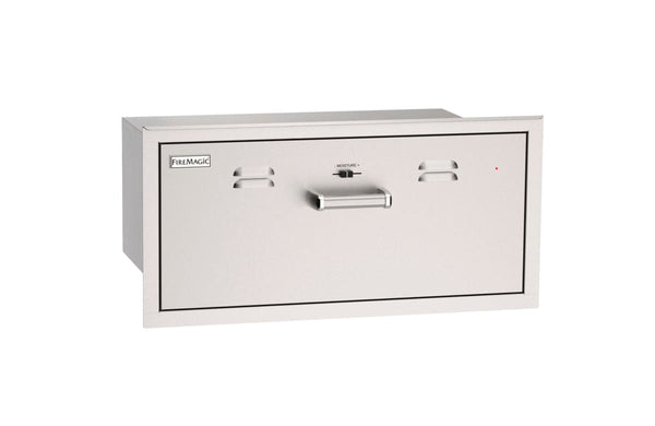 Stainless steel warming drawer with vent slots, front handle, and adjustable moisture control for keeping food warm outdoors.
