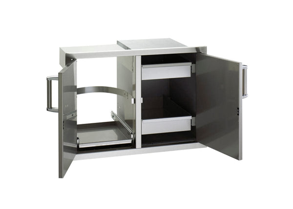Stainless steel outdoor kitchen storage unit with double doors open, showing pull-out trash bin holder and two sliding storage drawers.