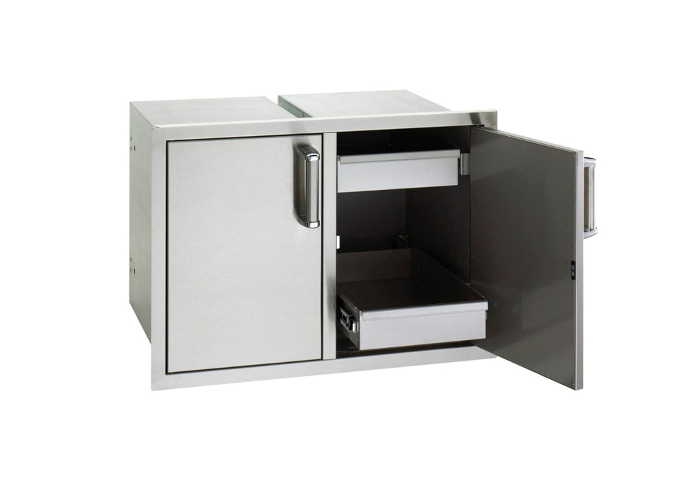 Stainless steel outdoor kitchen cabinet with one door closed and the other open, revealing two sliding storage drawers inside.