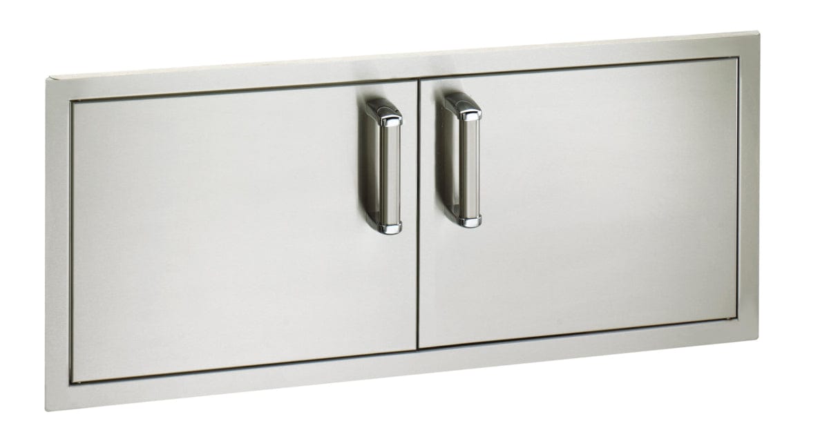 Sleek stainless steel double access doors with polished vertical handles, ideal for outdoor kitchen islands and built-in grill storage.