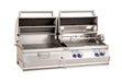 Open dual built-in stainless steel grill with charcoal and gas sections, rotisserie kit, warming racks, lights, and blue LED knobs.