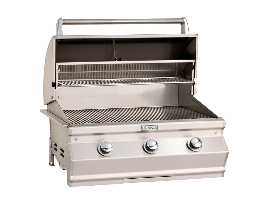Open stainless steel built-in gas grill with three control knobs, spacious grilling area, and upper warming rack for outdoor cooking.