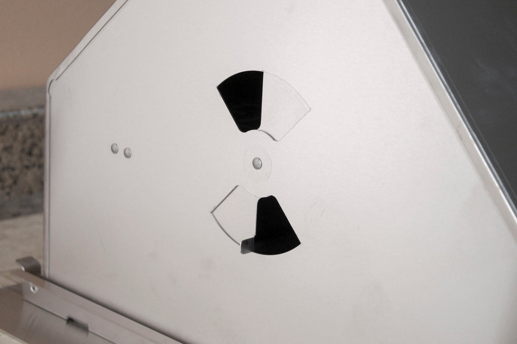 Close-up of adjustable vent damper on stainless steel grill side panel, designed for airflow control during charcoal grilling.