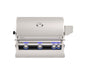 Stainless steel built-in gas grill with curved lid, analog thermometer, and blue LED-lit control knobs for luxury outdoor cooking.
