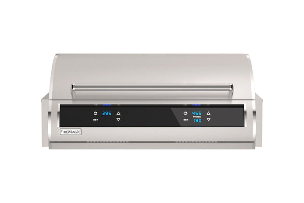 Stainless steel built-in gas grill with sleek curved lid, dual digital temperature displays, and modern touch controls for outdoor cooking.