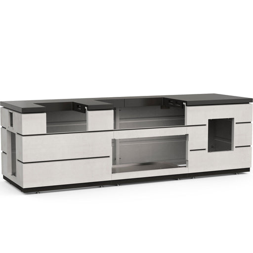 Outdoor kitchen island base in light concrete finish with black countertop and multiple cutouts for built-in grill, fridge, and storage.