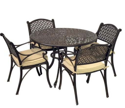 Round metal patio table with intricate lattice design and four matching cushioned chairs featuring decorative backrests, perfect for outdoor dining.