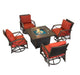 Outdoor fire pit table set with a square fire pit featuring brown frame, red cushioned swivel chairs, and a stylish patio setup.