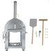 Stainless steel outdoor pizza oven with a chimney, freestanding cart, and included accessories: pizza peel, brush, cutter, spatula, and hooks