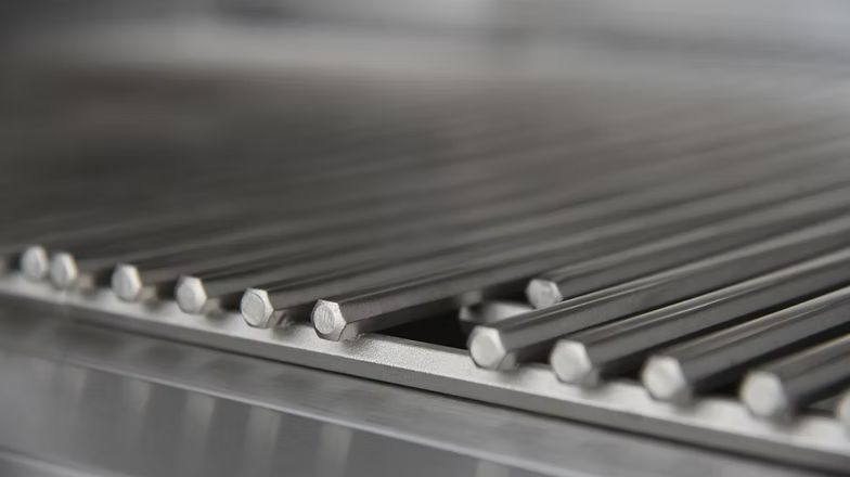 Close-up view of heavy-duty stainless steel grill grates, showing durable hexagonal rods designed for high heat and even cooking performance.