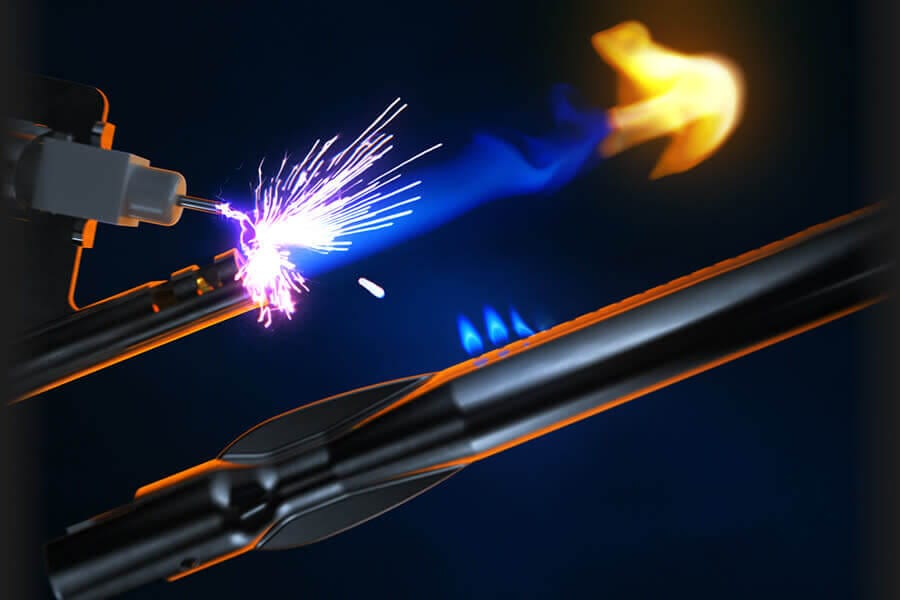 Close-up of a spark ignition system with blue and orange flames, illustrating efficient and quick burner ignition for outdoor grills.