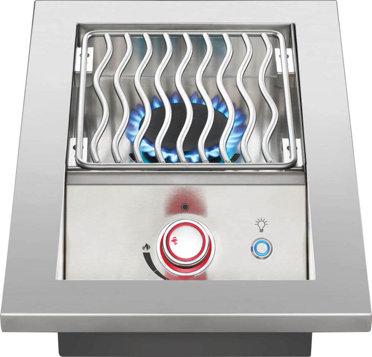 Stainless steel outdoor burner with wavy grill grates, red-lit control knob, and visible blue flame for efficient cooking.