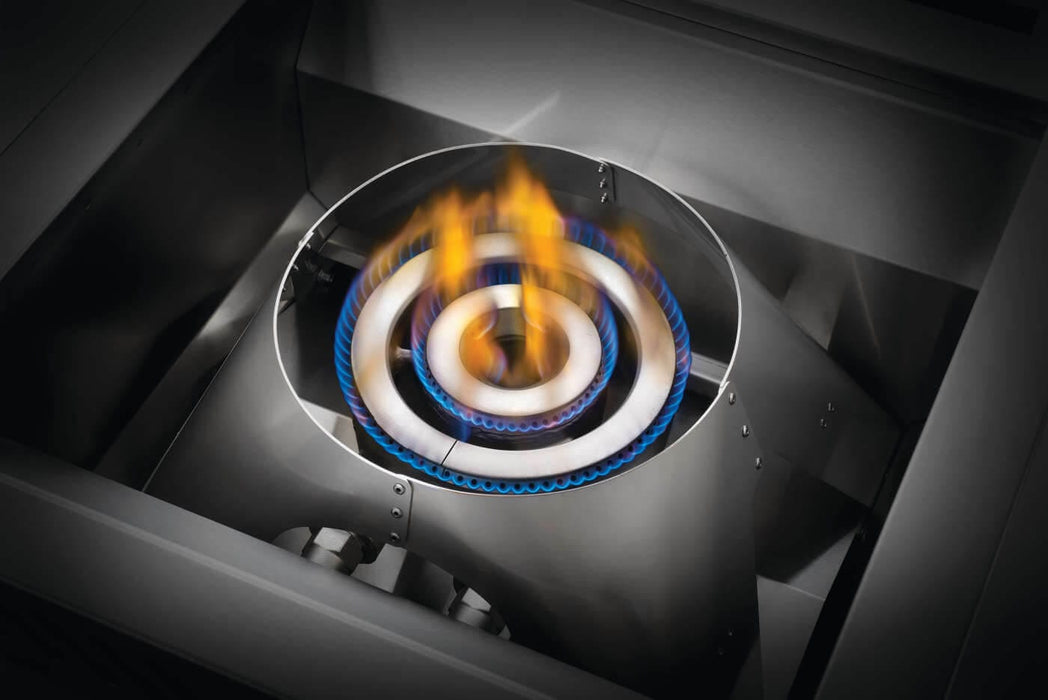 Close-up of a stainless steel circular gas burner with blue and yellow flames, designed for high-performance outdoor cooking.