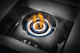 Close-up of a stainless steel circular gas burner with blue and yellow flames, designed for high-performance outdoor cooking.