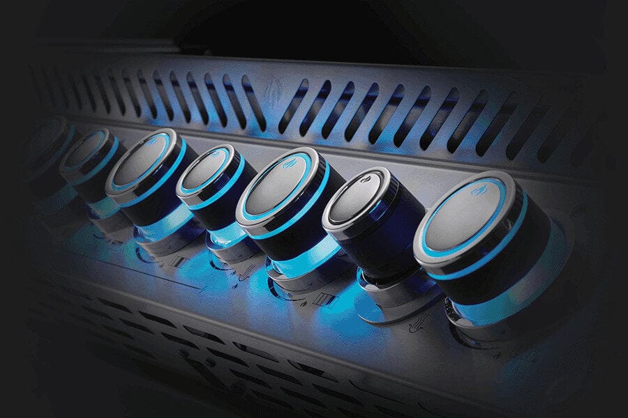 Close-up of illuminated blue control knobs on a stainless steel gas grill, showcasing a sleek and modern design for precise temperature control.