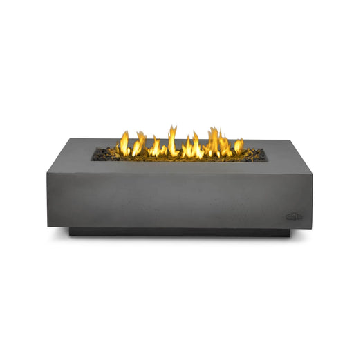 Rectangular outdoor fire table with a sleek gray concrete design and a central fire feature filled with black fire glass and flames.