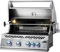 Stainless steel gas grill with an open hood, interior lighting, rotisserie setup, blue illuminated knobs, and grilling grates.