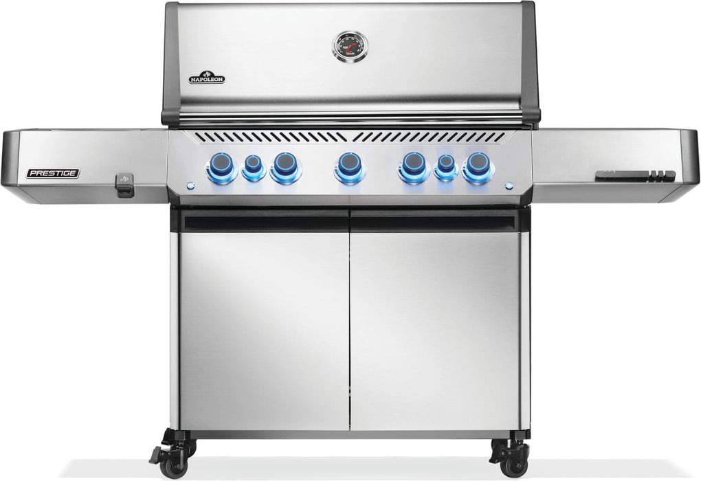 Stainless steel outdoor gas grill with a sleek design, illuminated control knobs, and double-door storage cabinet on caster wheels.