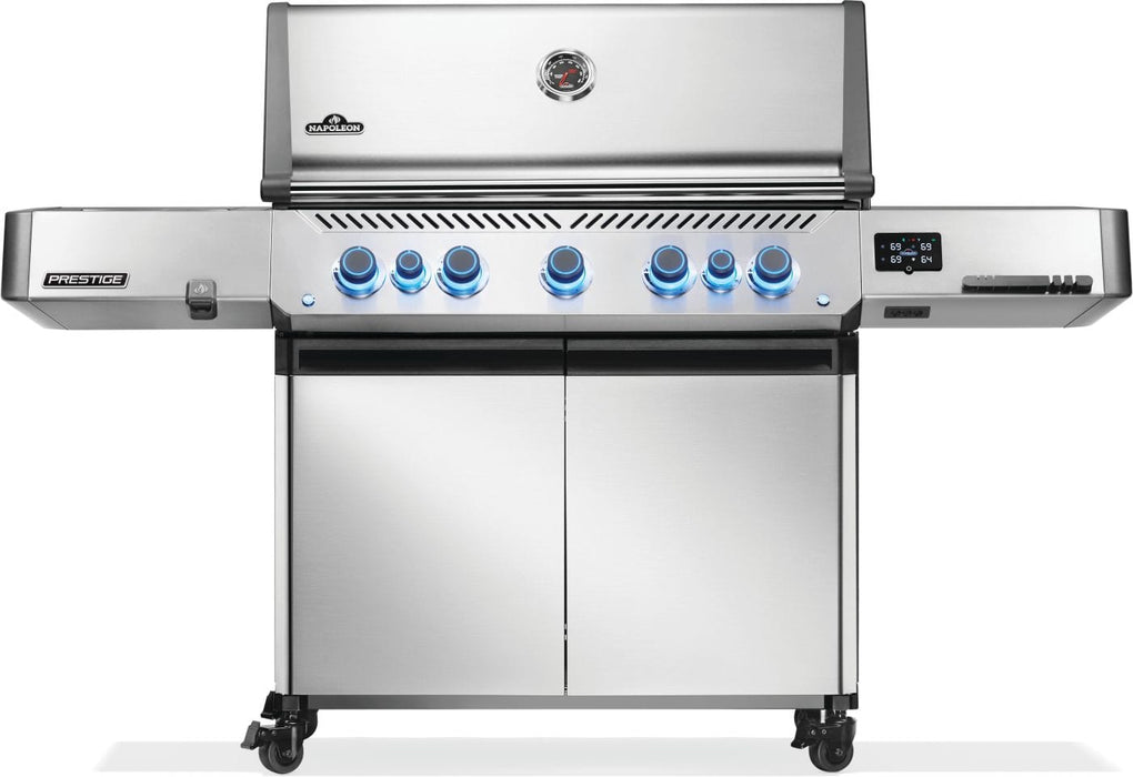 Stainless steel grill with illuminated blue control knobs, a digital display panel, dual cabinet doors, and a temperature gauge on top.