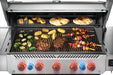 Grill with red and blue illuminated knobs, cooking kebabs, corn, vegetables, and flatbreads on open grates under a stainless steel lid.