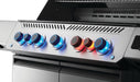 Close-up of illuminated grill control knobs in blue and red, showcasing their sleek design and functionality against a stainless steel panel.