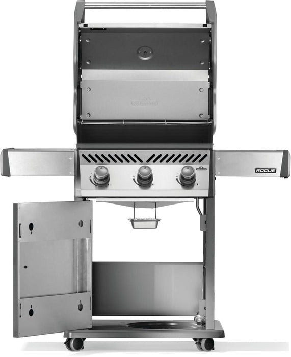 Stainless steel grill with the hood open, revealing the cooking chamber, three control knobs, open storage cabinet, and grease tray.