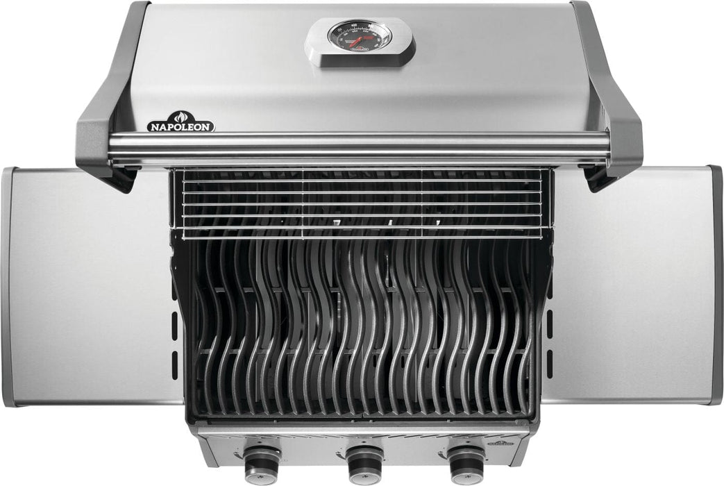 Top view of a stainless steel grill with three control knobs, wave-shaped cooking grates, warming rack, and foldable side shelves.