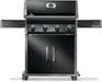 Black freestanding outdoor grill with four control knobs, a thermometer on the lid, foldable side shelves, and double-door storage below.