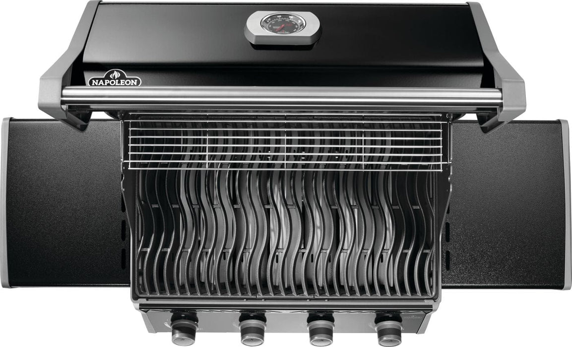 Top view of an open grill showcasing wavy cooking grates, an upper warming rack, and side shelves with a sleek black finish.