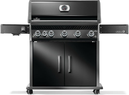 Front view of a black grill with six control knobs, two side shelves, enclosed storage cabinet, and caster wheels for mobility.