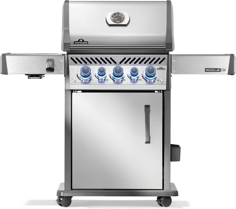 Stainless steel gas grill with illuminated control knobs, closed storage cabinet, and side shelves, shown on caster wheels.