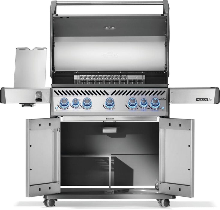 Stainless steel grill with open cabinet doors, five illuminated control knobs, lid open showing grilling surface and side burner.